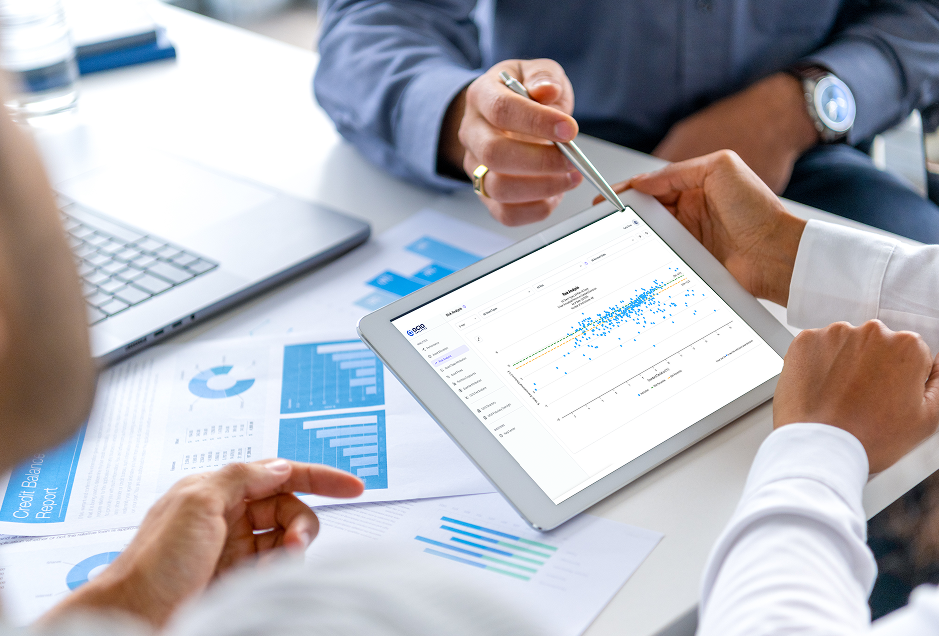 Team reviewing performance analytics on tablet